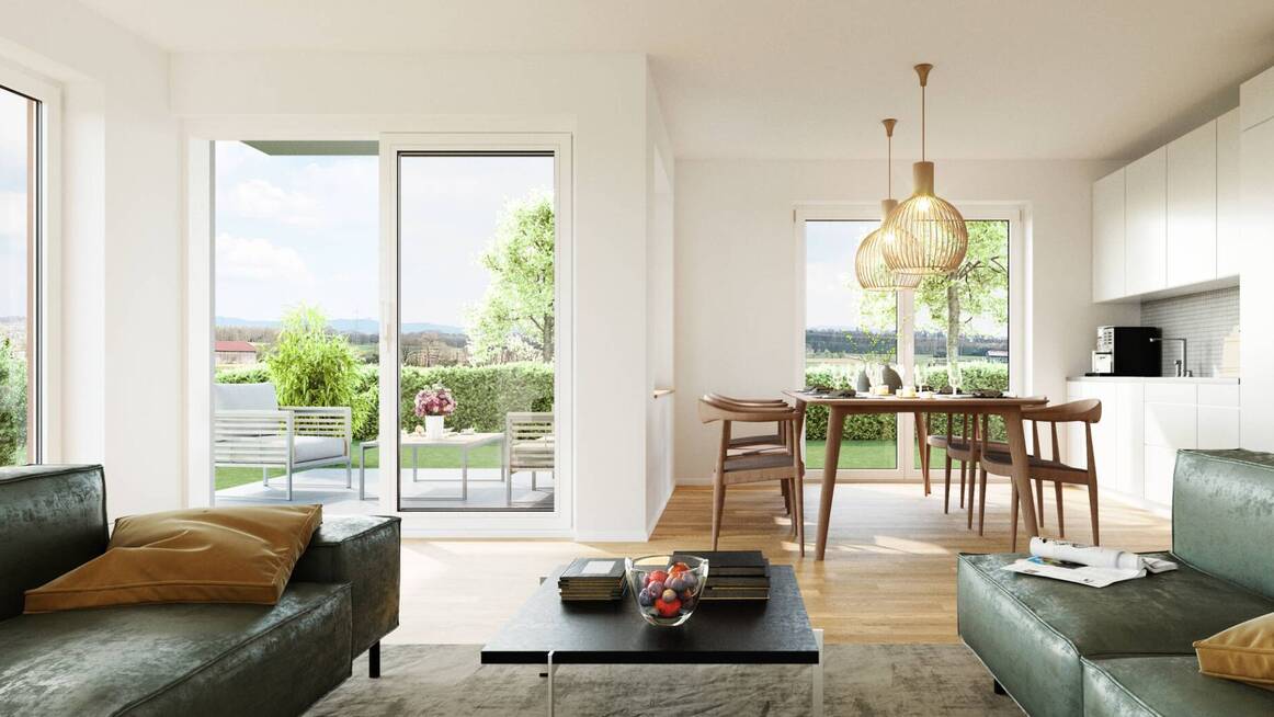 Heller Wohn- und Essbereich einer Eigentumswohnung in Altdorf mit Zugang zur eigenen Terrasse und Ausblick auf den Garten